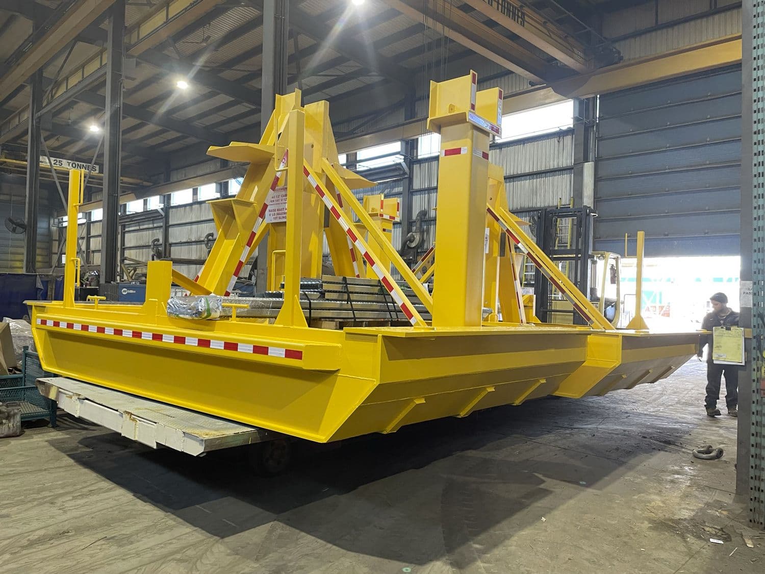 Yellow cable stands in fabrication shop